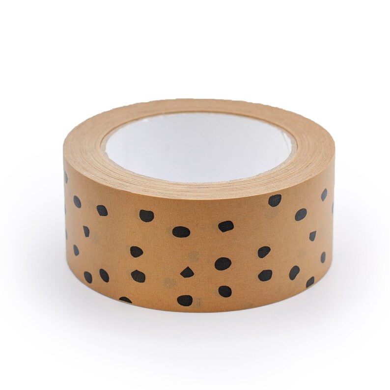 May include: A roll of brown packing tape with a black polka dot pattern. The tape is on a white background.