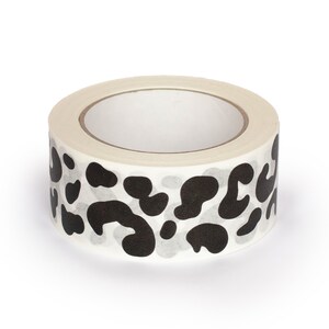 May include: A roll of white washi tape with a black leopard print design.