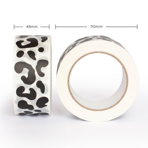 May include: A roll of white washi tape with a black leopard print design. The tape is 48mm wide and 110mm in diameter.
