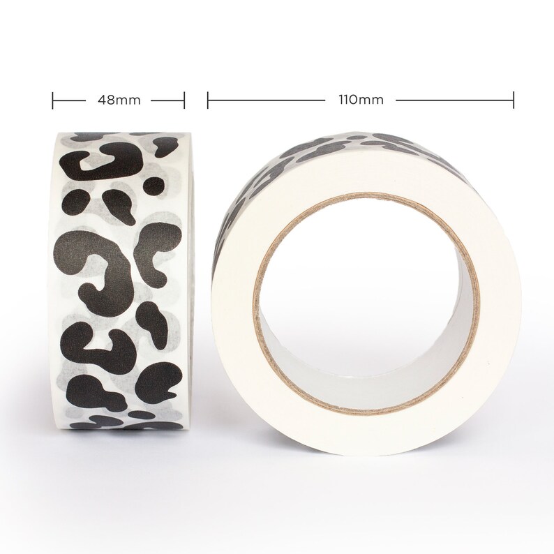 May include: A roll of white washi tape with a black leopard print design. The tape is 48mm wide and 110mm in diameter.
