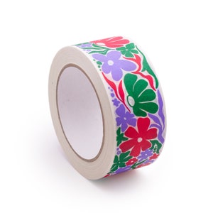 May include: A roll of white tape with a floral design. The tape features red, green, and purple flowers.