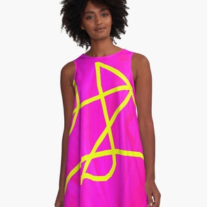 May include: A sleeveless pink dress with a yellow abstract design. The dress has a flowy, A-line silhouette.