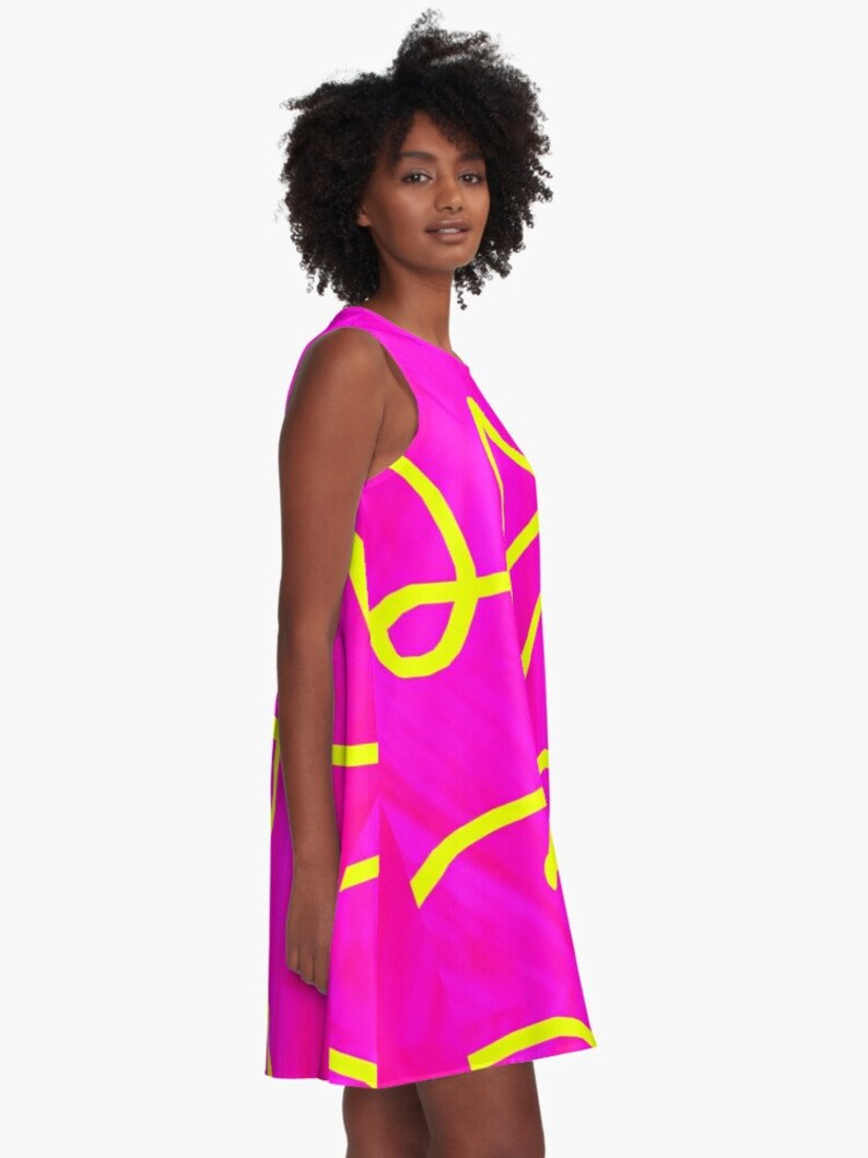 May include: A sleeveless dress with a bright pink background and yellow abstract lines.