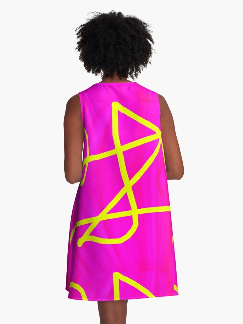 May include: A sleeveless pink dress with a yellow abstract design.