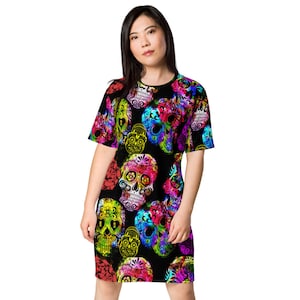 May include: A black t-shirt dress with a colorful sugar skull print. The skulls are decorated with flowers and have a rainbow color scheme.