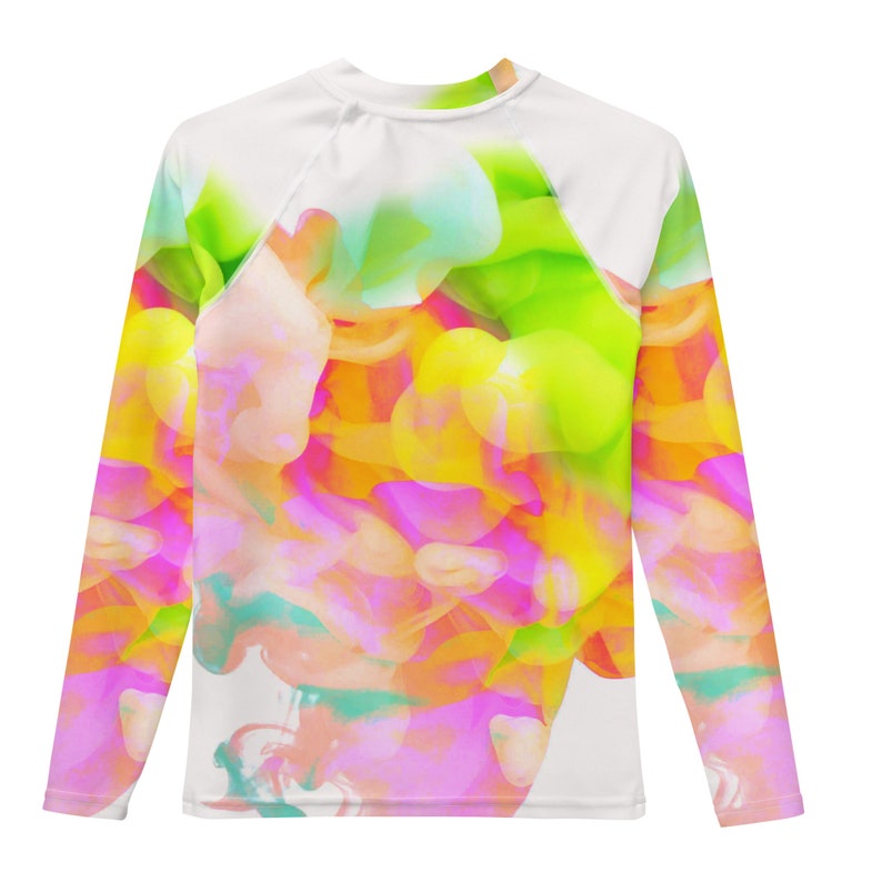 May include: A long-sleeved shirt with a colorful abstract design featuring pink, yellow, green, and blue hues. The design resembles a swirling cloud of paint.