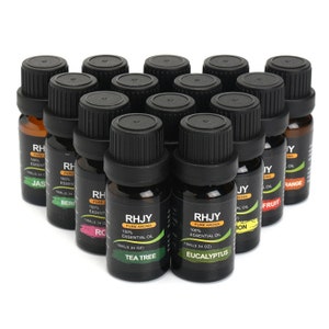 May include: A set of 15 small, black-capped bottles filled with essential oils. The bottles are arranged in a heart shape and labeled with different essential oil names, including Tea Tree, Eucalyptus, Lemon, Orange, and Bergamot.