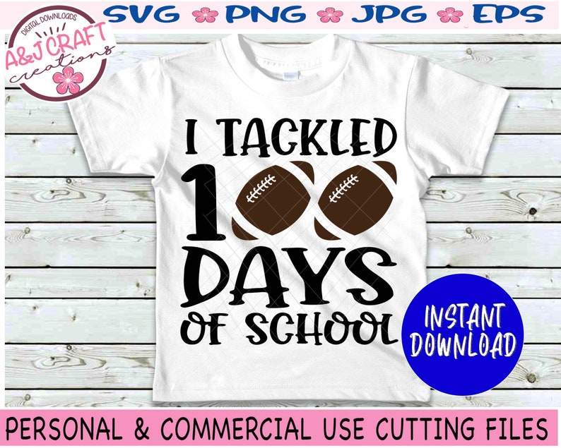 May include: A white short-sleeved t-shirt featuring the black text I TACKLED 100 DAYS OF SCHOOL with two brown footballs replacing the zeros in the number 100. The design is centered on the front of the shirt with bold, black lettering.