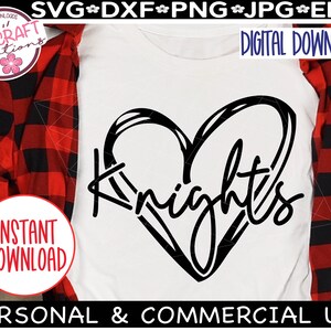 May include: A black and white graphic design of a heart with the word "Knights" written inside. The design is on a white t-shirt.