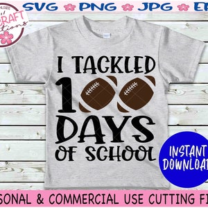 May include: A light gray short-sleeve t-shirt featuring the black text I TACKLED 100 DAYS OF SCHOOL with two brown football graphics replacing the zeros. The design is centered on the front of the shirt, which is displayed as a digital file.