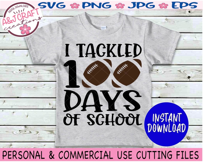 May include: A light gray short-sleeve t-shirt featuring the black text I TACKLED 100 DAYS OF SCHOOL with two brown football graphics replacing the zeros. The design is centered on the front of the shirt, which is displayed as a digital file.