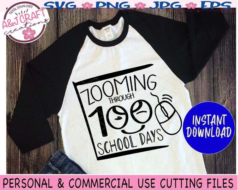 May include: A white t-shirt with a black design that says "Zooming Through 100 School Days" with a cartoon mouse and two smiley faces. The design is in a black square with a white outline.