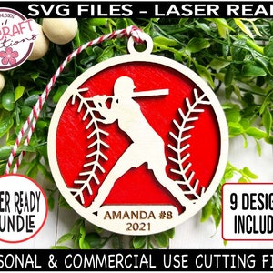 May include: A red and white baseball-themed ornament with a silhouette of a baseball player. The ornament is laser-cut and ready to be personalized with a name and year. The text on the ornament reads "AMANDA #8 2021".