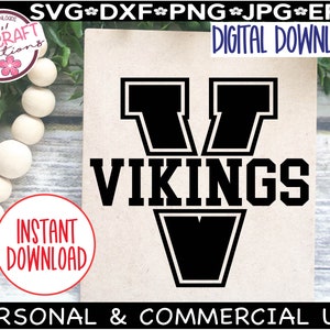 May include: Black and white digital download graphic of a stylized "V" with the word "VIKINGS" in bold letters below. The graphic is on a brown background.