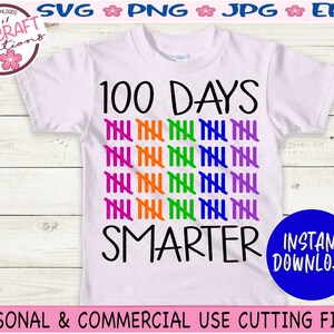 May include: A pink t-shirt with the text "100 DAYS SMARTER" in black. The number 100 is represented by 10 rows of 10 tally marks in alternating colours of purple, orange, green, and blue.