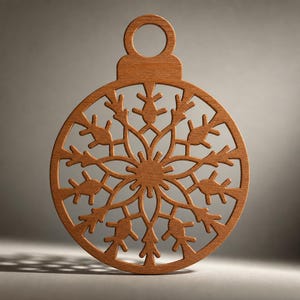May include: A circular wooden ornament featuring a laser-cut snowflake design with intricate geometric patterns and a small loop at the top for hanging. The natural brown wood has a smooth finish and a detailed, symmetrical cutout structure.
