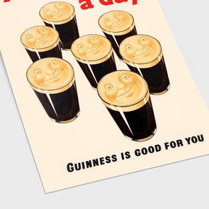 May include: A retro poster showing seven pints of dark stout with smiling faces on the creamy heads. The text "Guinness is good for you" is printed at the bottom. The poster has a cream-coloured background.