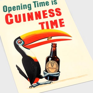 May include: A retro poster showing a toucan with a Guinness Extra Stout bottle. The toucan has a yellow, red, and white beak, with black and white feathers. The poster reads "Opening Time is Guinness Time" in green and red.