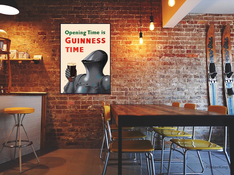 May include: A framed poster with the text "Opening Time is Guinness Time" features a knight in armor holding a pint of dark beer. The poster hangs on a brick wall in a pub setting, with a bar and tables visible.