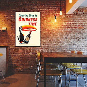 May include: A vintage Guinness poster featuring a toucan holding a bottle of Guinness beer. The poster reads "Opening Time is Guinness Time".