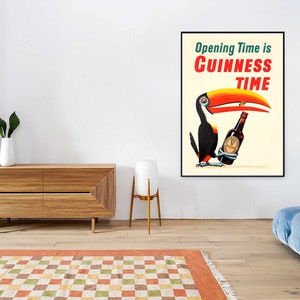 May include: A vintage poster advertising Guinness beer. The poster features a toucan holding a bottle of Guinness with the text "Opening Time is Guinness Time".