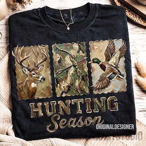 May include: Black t-shirt with a hunting theme. The shirt features three framed images: a deer, a bow and arrow, and a duck in flight. The words "HUNTING Season" are printed below the images in a textured font. The text "ORIGINALDESIGNER" is printed below the words "Hunting Season".