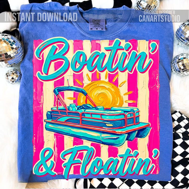 May include: Blue sweatshirt with a graphic that says "Boatin' & Floatin'". The graphic features a pontoon boat, a sun, and pink and yellow stripes. The words "Instant Download" and "Original Designer CanArtStudio" are also visible.