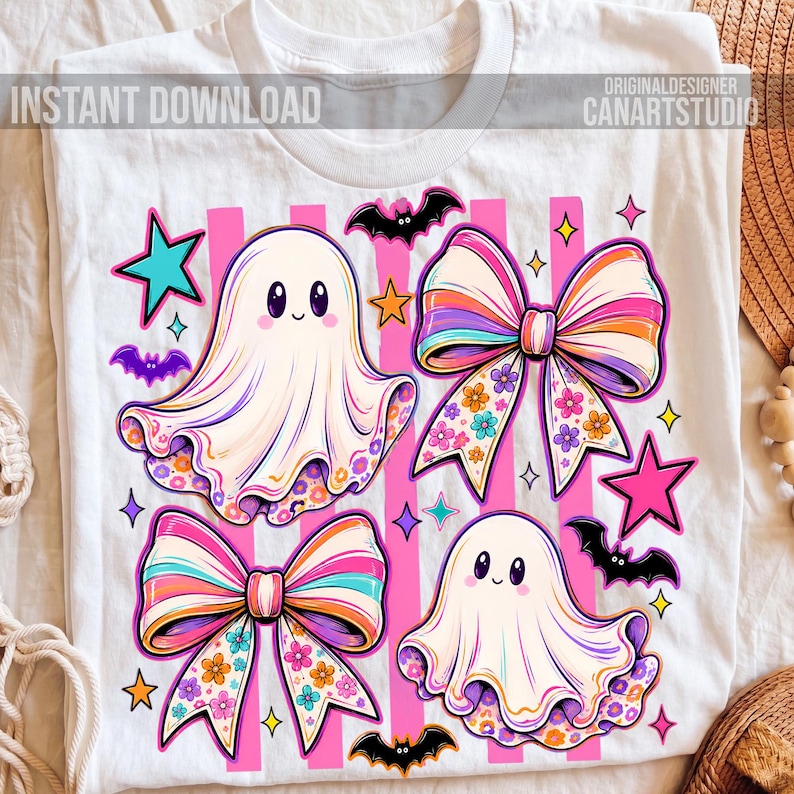 May include: A white t-shirt featuring a graphic print of two ghosts, two large bows with floral patterns, bats, and stars. The design includes vertical pink stripes and the text INSTANT DOWNLOAD and ORIGINALDESIGNER CANARTSTUDIO.