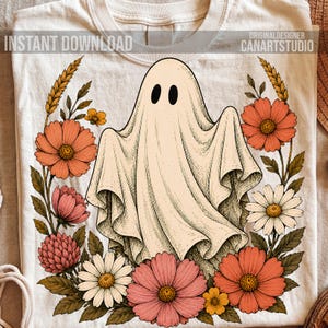 May include: A cream-colored t-shirt featuring a central graphic of a ghost surrounded by a wreath of orange, pink, and white flowers with wheat stalks. The text INSTANT DOWNLOAD and ORIGINALDESIGNER CANARTSTUDIO is printed at the top of the shirt.