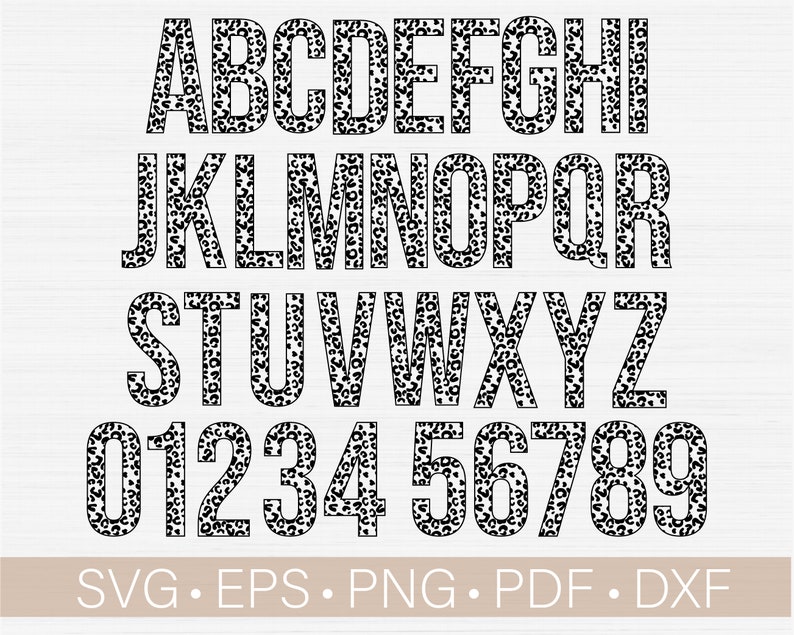 May include: Black and white leopard print alphabet letters and numbers. The letters are uppercase and the numbers are in a bold font. The letters and numbers are outlined in black.