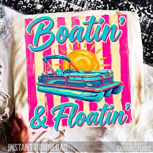 May include: Cream-colored t-shirt with a vibrant graphic. The design features a turquoise pontoon boat, a yellow sun, and the words "Boatin' & Floatin'" in turquoise script against a pink and yellow striped background. "Instant Download" is also visible.