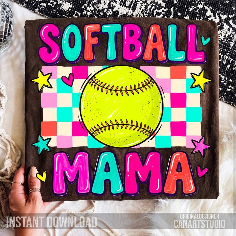 May include: A brown t-shirt with the words "SOFTBALL MAMA" in colorful bubble letters. A neon yellow softball is in the center, with a checkered background of pink, blue, and orange squares. The shirt also has star and heart graphics.