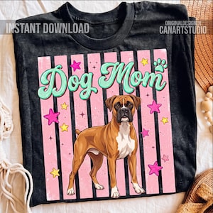 May include: Black t-shirt with a "Dog Mom" design. The design features a brown Boxer dog, pink and white stripes, stars, and a paw print. The words "Instant Download" are in the upper left corner.