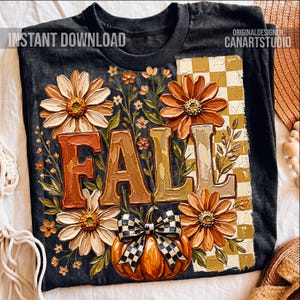 May include: Black t-shirt with a fall-themed design. The design features the word "FALL" in large, textured letters, surrounded by flowers and a pumpkin with a checkered bow. The words "INSTANT DOWNLOAD" and "ORIGINALDESIGNER CANARTSTUDIO" are also visible.