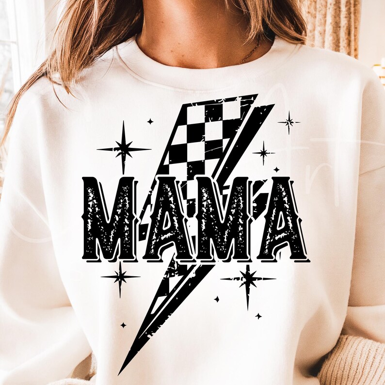 May include: White sweatshirt with a black graphic of a lightning bolt with a checkered flag design and the word "MAMA" in a bold, vintage font.