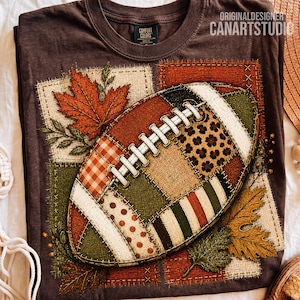 May include: A dark brown t-shirt featuring a large graphic of a football designed with a patchwork pattern of plaid, leopard print, polka dots, and stripes. The football is surrounded by autumn maple leaves and text reading ORIGINALDESIGNER CANARTSTUDIO.