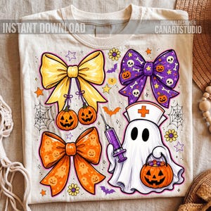 May include: A cream-colored t-shirt featuring a graphic print of three decorative bows, a ghost dressed as a nurse holding a syringe, and a jack-o'-lantern bucket. The design includes small stars, flowers, spiderwebs, and bats in orange and purple.