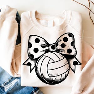May include: A black and white illustration of a volleyball with a polka dot bow on top. The volleyball is drawn in a vintage style.