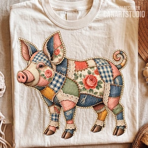 May include: A cream-colored t-shirt featuring a graphic of a pig designed with a patchwork pattern. The pig is composed of various fabric textures including blue gingham, floral prints, and solid colors, all outlined with a white beaded border.