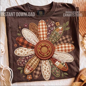 May include: Brown t-shirt featuring a large, embroidered daisy design. The daisy petals are patchwork with various patterns, including gingham, floral, and lace. The shirt has the text "INSTANT DOWNLOAD" and "CANARTSTUDIO".