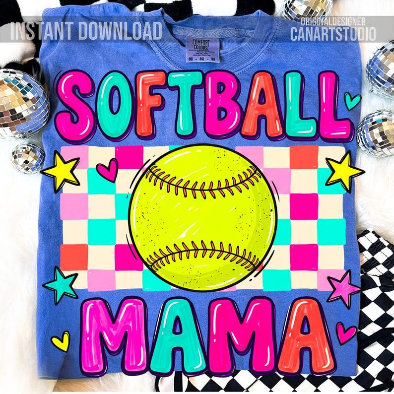 May include: A blue t-shirt with the words "SOFTBALL MAMA" in bubble letters. The design includes a yellow softball, stars, and hearts on a checkered background. The shirt is a Comfort Colors brand.