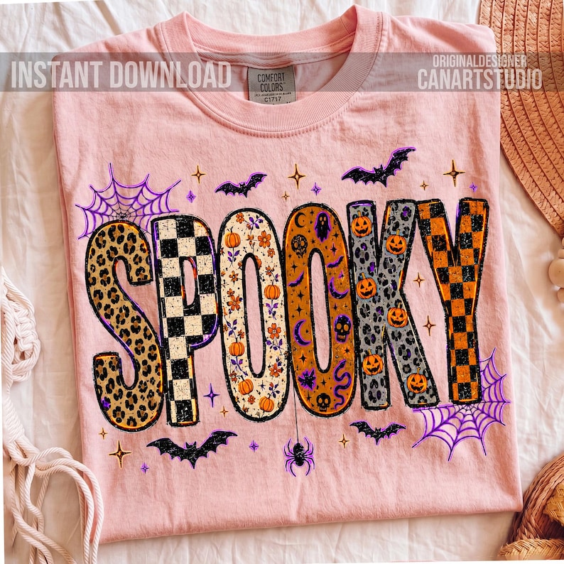 May include: A light pink t-shirt with the word "SPOOKY" in a Halloween-themed design. The letters feature leopard print, checkerboard, floral, and pumpkin patterns. Bats, spiderwebs, and stars surround the word. The shirt has the text "INSTANT DOWNLOAD" and "ORIGINALDESIGNER CANARTSTUDIO".