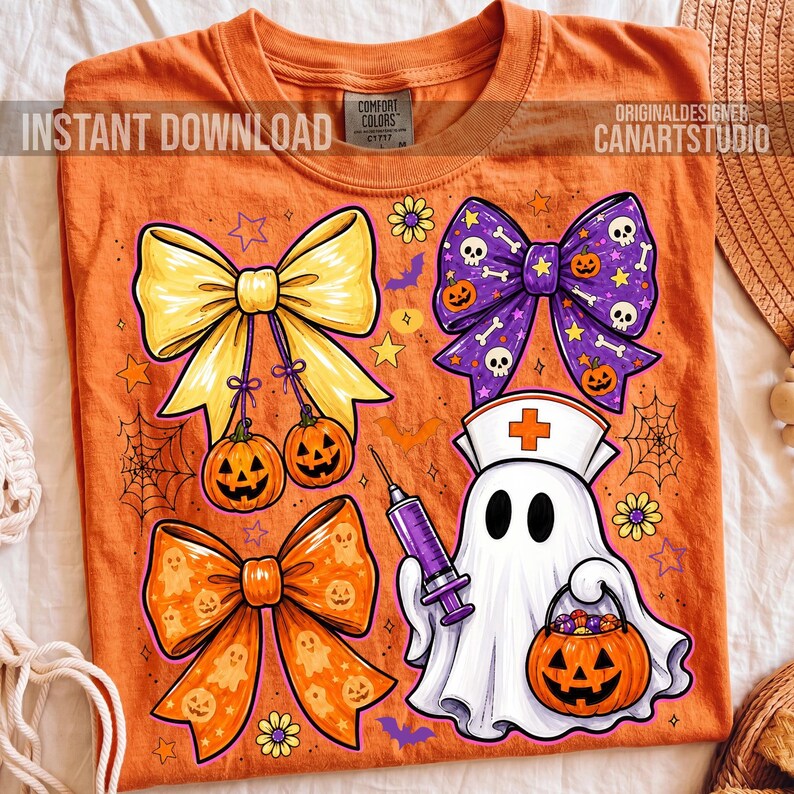May include: An orange t-shirt featuring a graphic print of three decorative bows, a ghost wearing a nurse cap and holding a syringe, and a jack-o'-lantern candy bucket. The design includes small stars, flowers, spiderwebs, and bats.