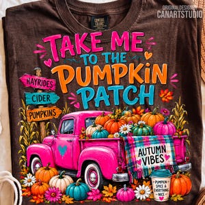 May include: A brown t-shirt featuring a graphic of a pink pickup truck and a signpost with arrows pointing to Hayrides, Cider, and Pumpkins. The text reads Take Me To The Pumpkin Patch and Autumn Vibes. Pumpkins and autumn leaves surround the truck.