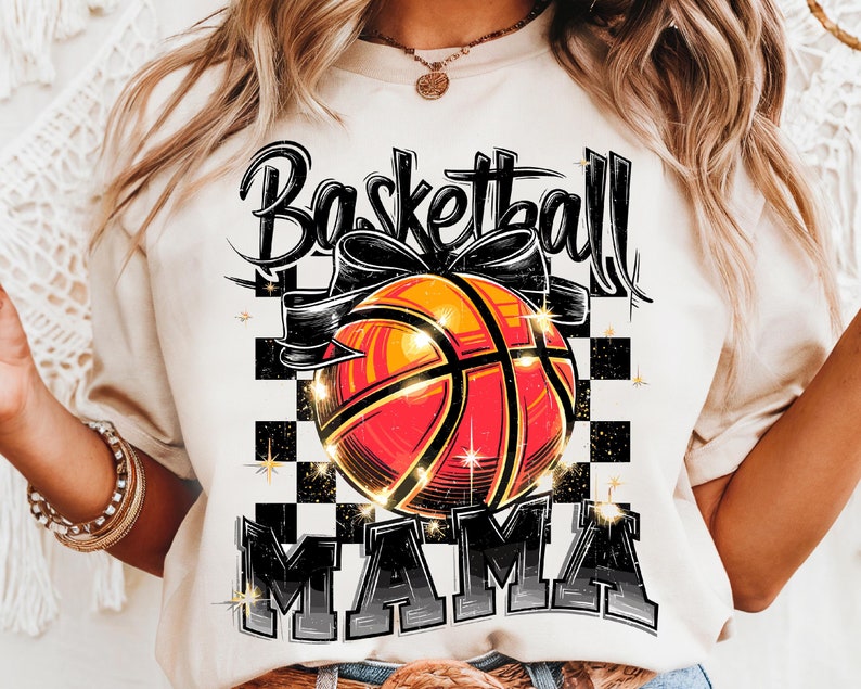 May include: A white t-shirt with a black and orange basketball graphic and the text "Basketball Mama".