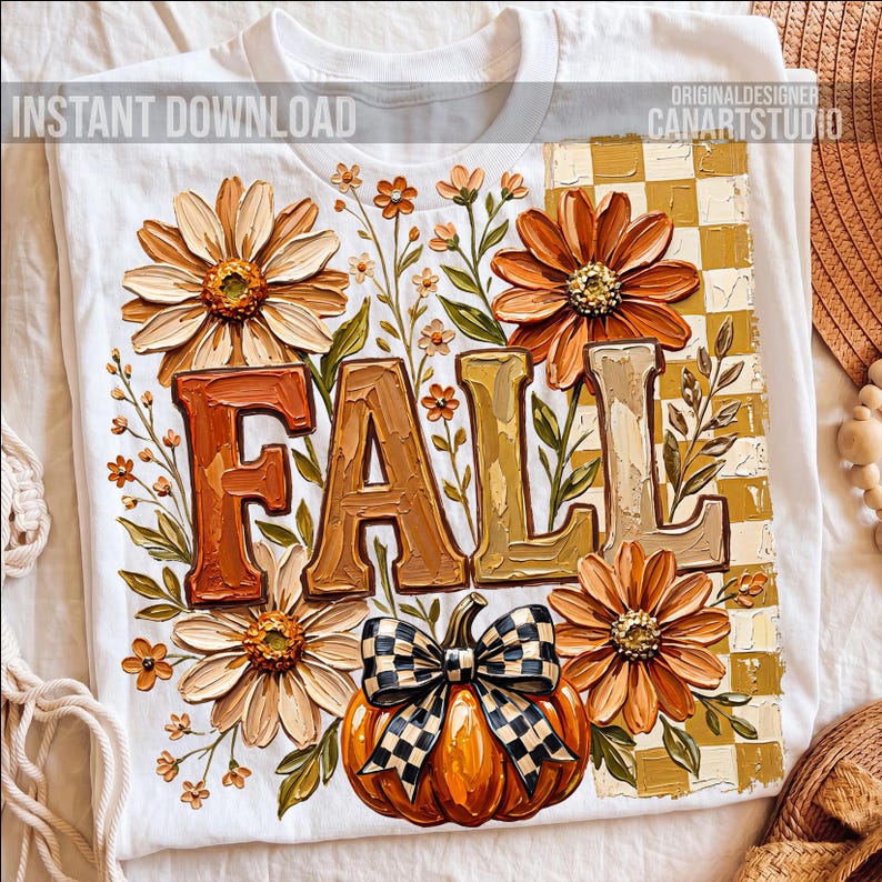 May include: White t-shirt featuring a fall-themed design. The design includes the word "FALL" in textured letters, surrounded by orange and cream-colored flowers, a pumpkin with a checkered bow, and the text "INSTANT DOWNLOAD".