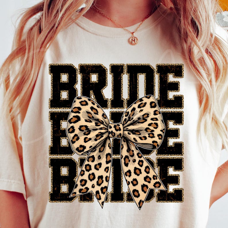 The backdrop is a strong "BRIDE" writing in distressed leopard print, and the foreground features a detailed cheetah-print bow. Together, these elements create a bridal motif that is trendy, contemporary, and wild.