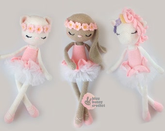 May include: Three crocheted ballerina dolls, a white cat, a brown bunny, and a white unicorn, all wearing pink tutus and flower crowns. The dolls are sitting on a white background.