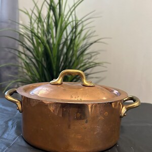Vintage French small 1 qt oval copper stew pot with brass handles.