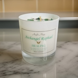 May include: White candle with green crystals and a label that reads "Angelic Magic Archangel Raphael Healing 7 Sacred Ray Serum (1) -  Aromatic Eucalyptus & Peppermint  REIKI CHARGED"